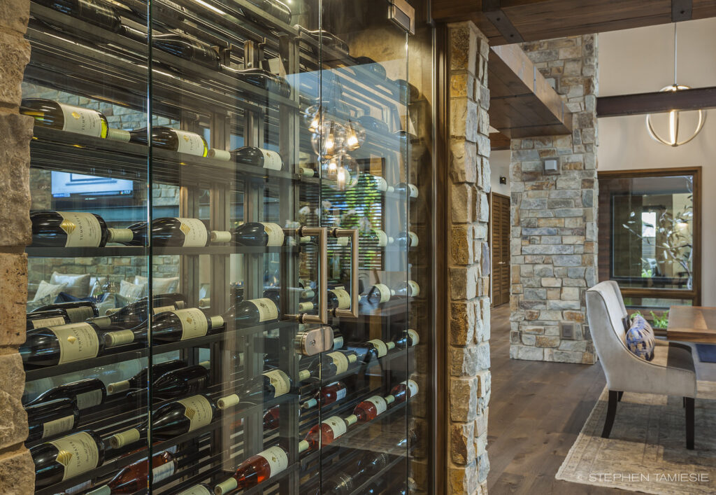 a double sided wine room surrounded by stonework